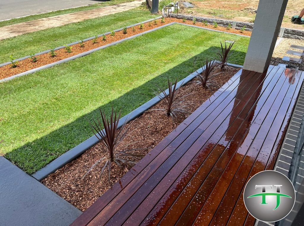 Lush green lawn installed by T&J Landscaping, experts in turfing services in Sydney